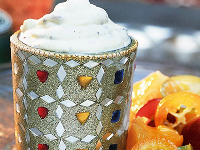 Yogurt ice cream with cardamom and almonds