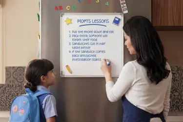 Mom teaching her daughter important life lessons before she heads to school