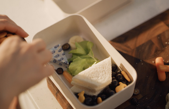 Toast Boat Lunchbox with Fresh Fruit and Puck Cheese Triangles 