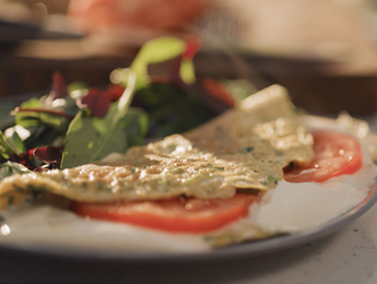 Fresh Herb Omelette with Tomato Slices and Cream Cheese Spread