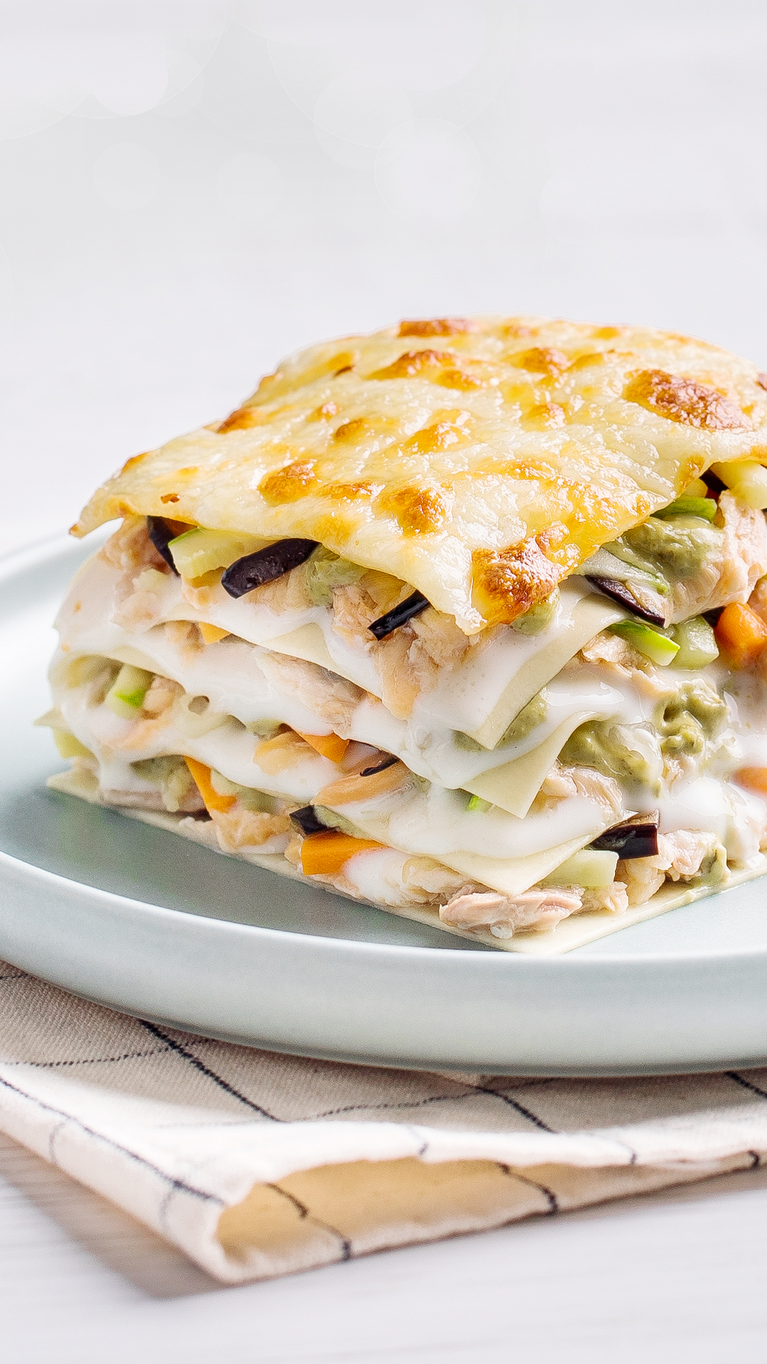 Salmon and vegetable lasagna with pesto and bechamel