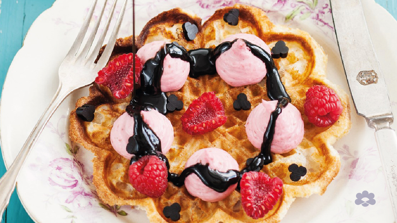 Waffles with whipped raspberry panna cotta and liquorice sauce 
